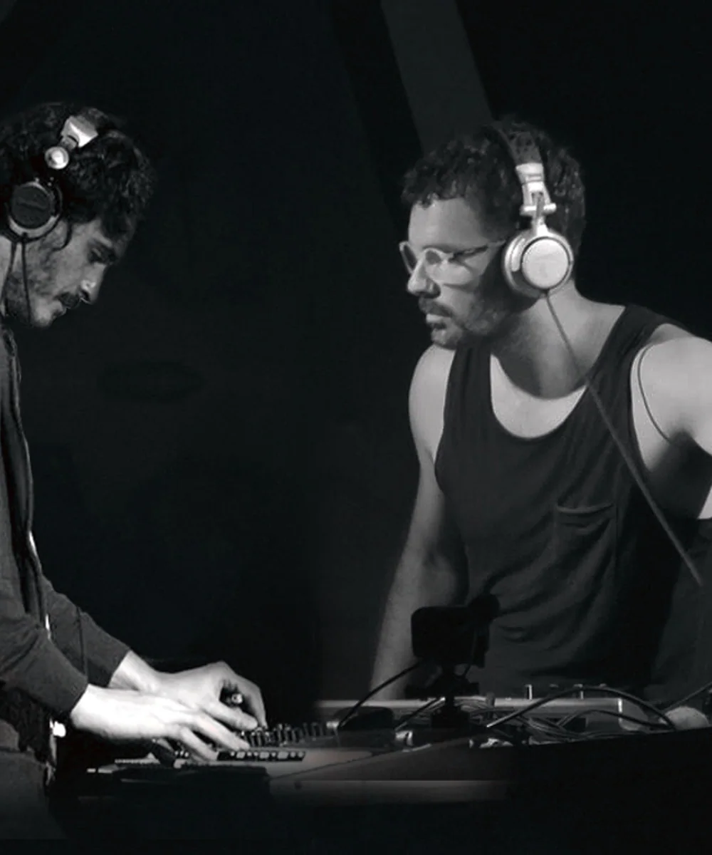 Digital Talk performing together in a black-and-white stage photograph