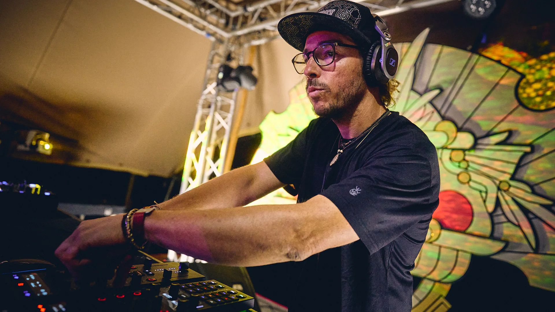 Trippy Fry mixing an electronic music set on stage